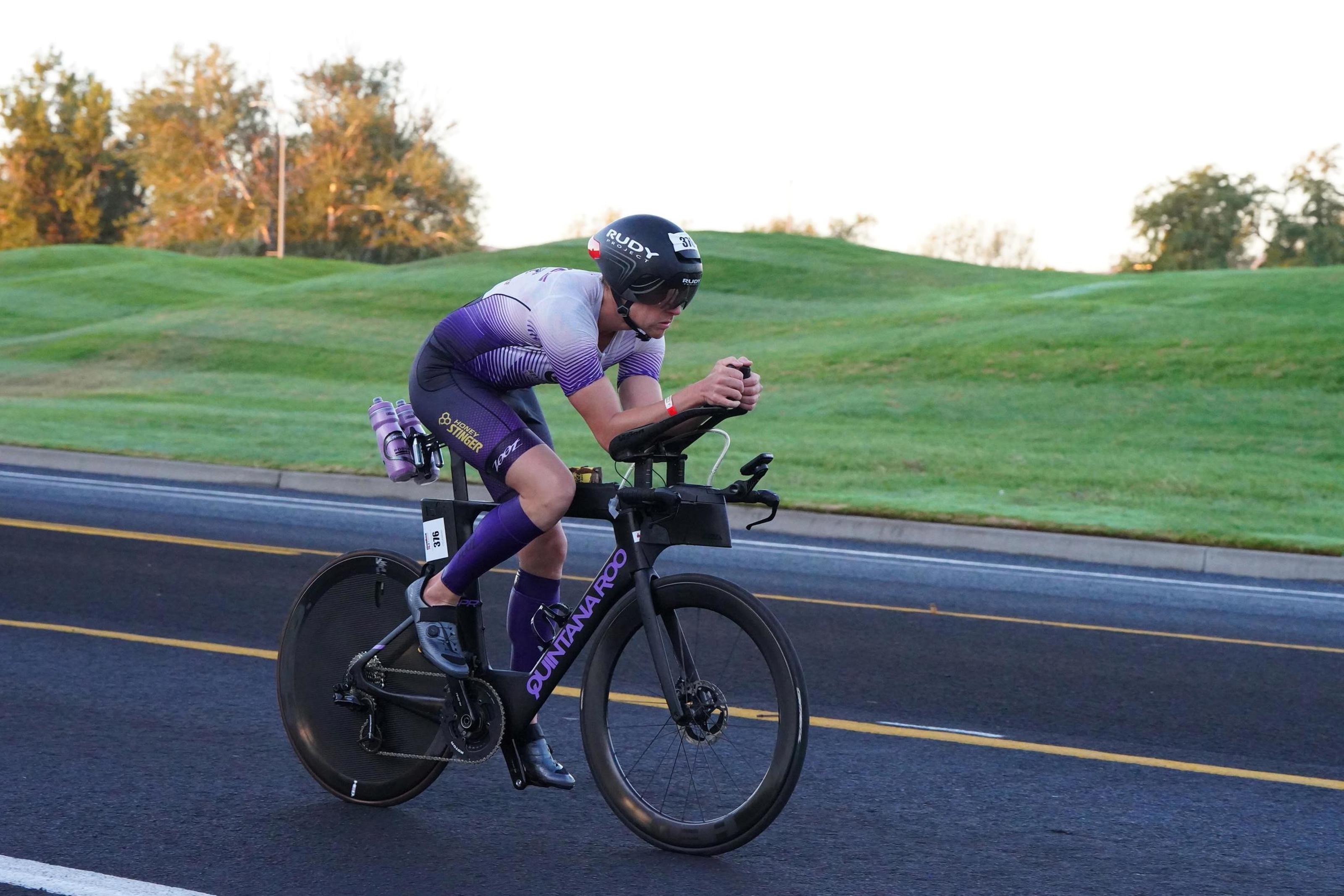 Dr. Hawes on the bike in a triathlon